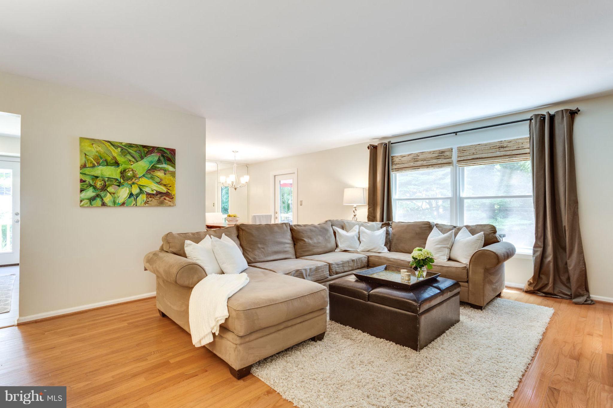 9147 Rockefeller Lane Springfield, VA 22153 - Photo 5 of 30 a living room with furniture and a large window