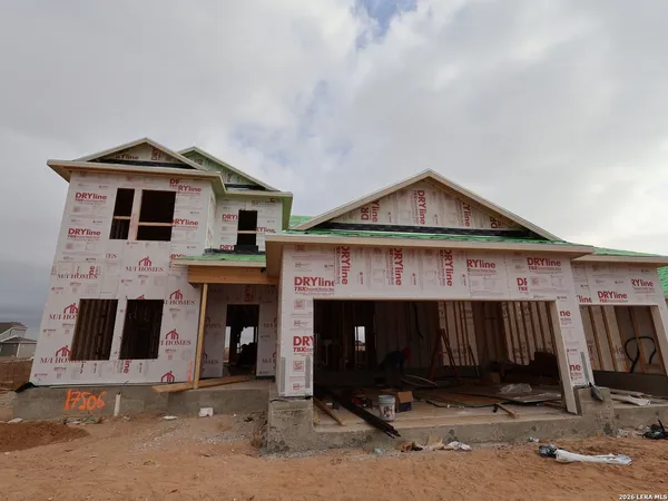 a front view of a house with yard