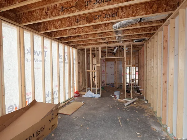 a view of porch with two chairs and a window