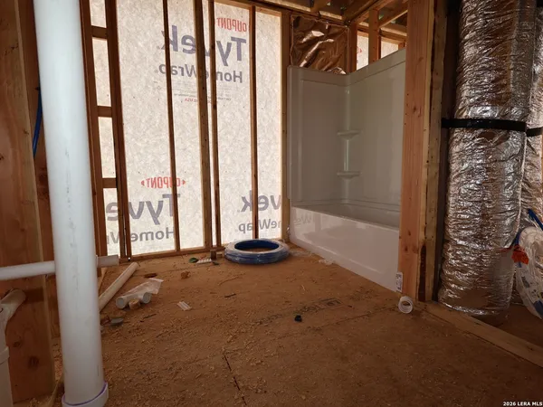 a view of an empty room with windows
