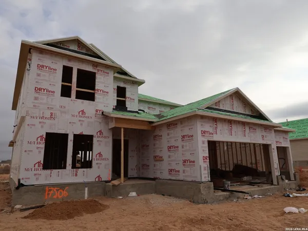 a front view of a house with garage