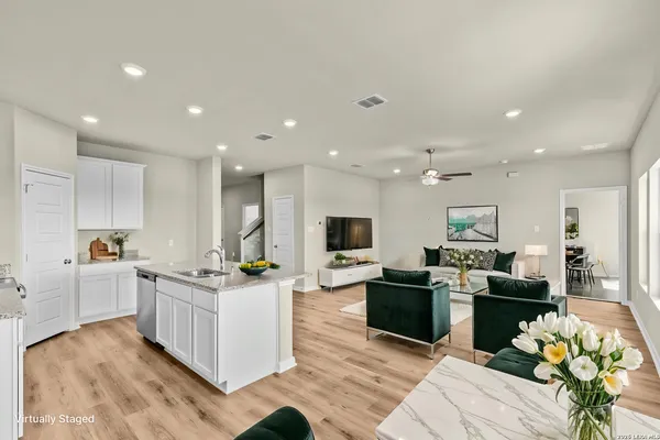 a kitchen with stainless steel appliances kitchen island granite countertop a sink and cabinets
