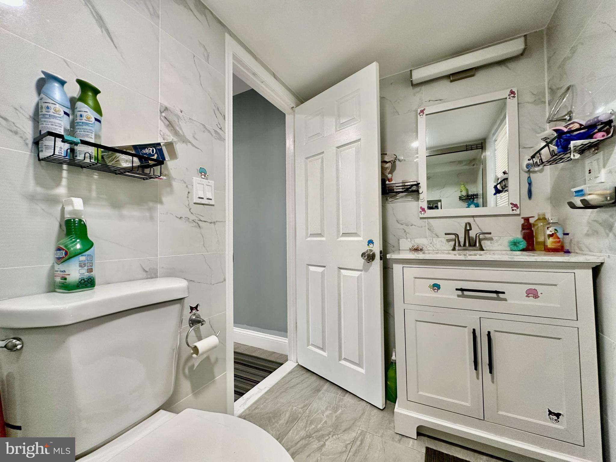 632 Durham Road Newtown, PA 18940 - Photo 17 of 36 a bathroom with a sink mirror vanity and toilet