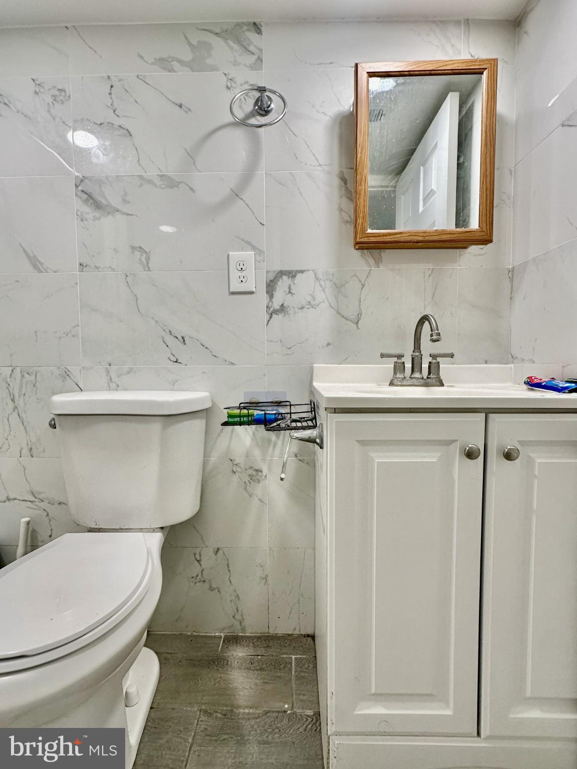 632 Durham Road Newtown, PA 18940 - Photo 28 of 36 a bathroom with a toilet sink and mirror