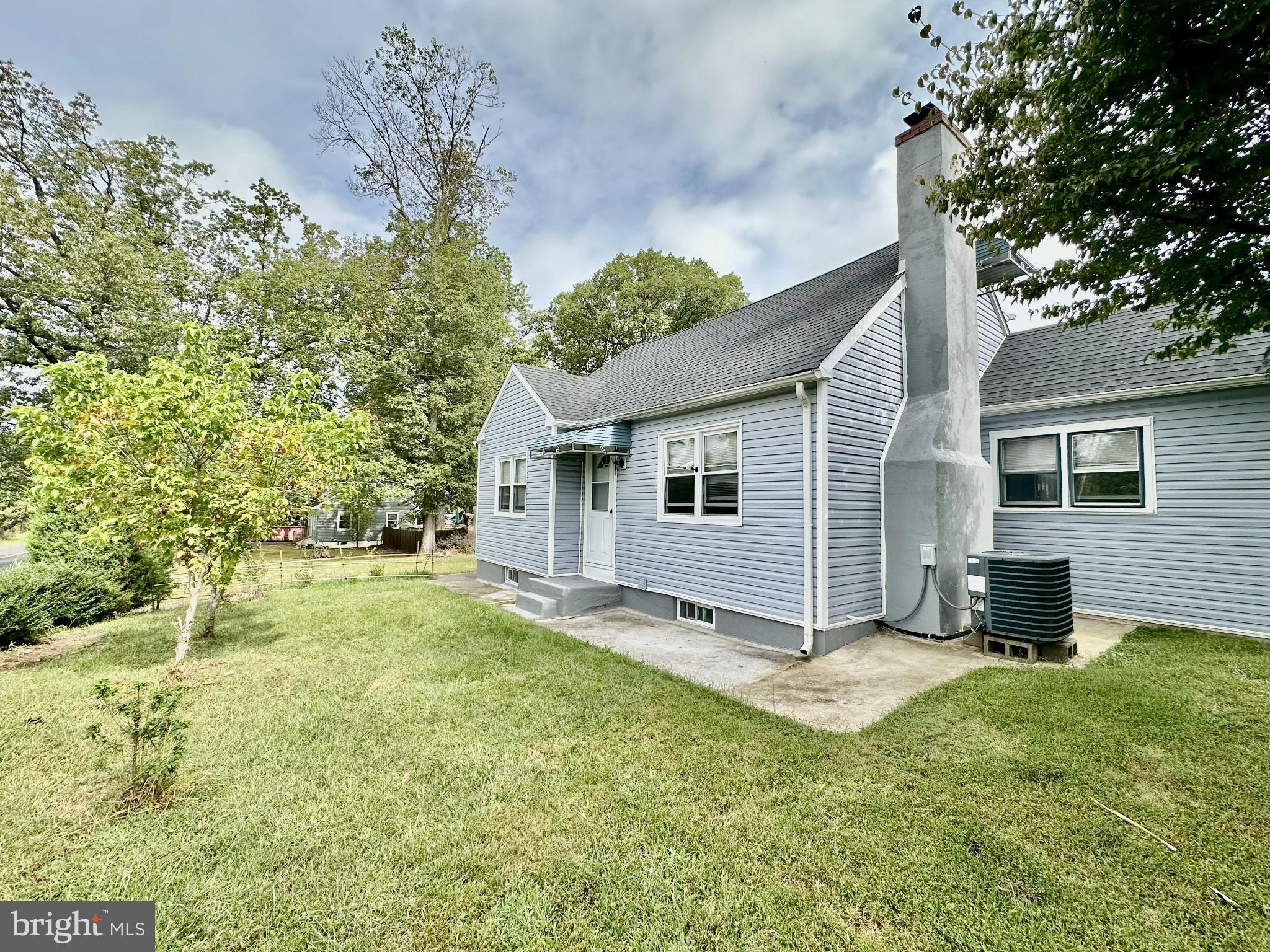 632 Durham Road Newtown, PA 18940 - Photo 36 of 36 a view of a backyard with a large tree