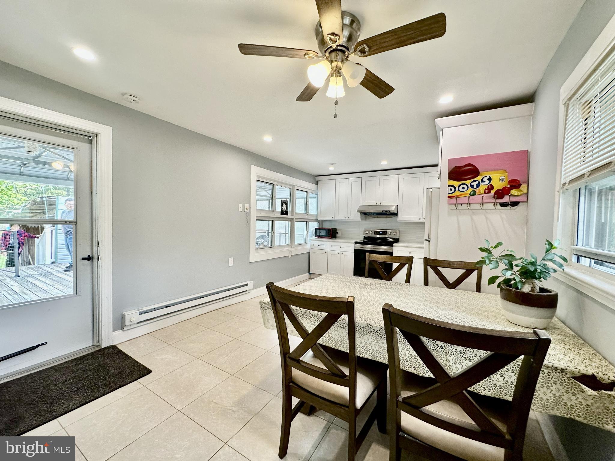 632 Durham Road Newtown, PA 18940 - Photo 6 of 36 a view of a dining room with furniture and a chandelier fan