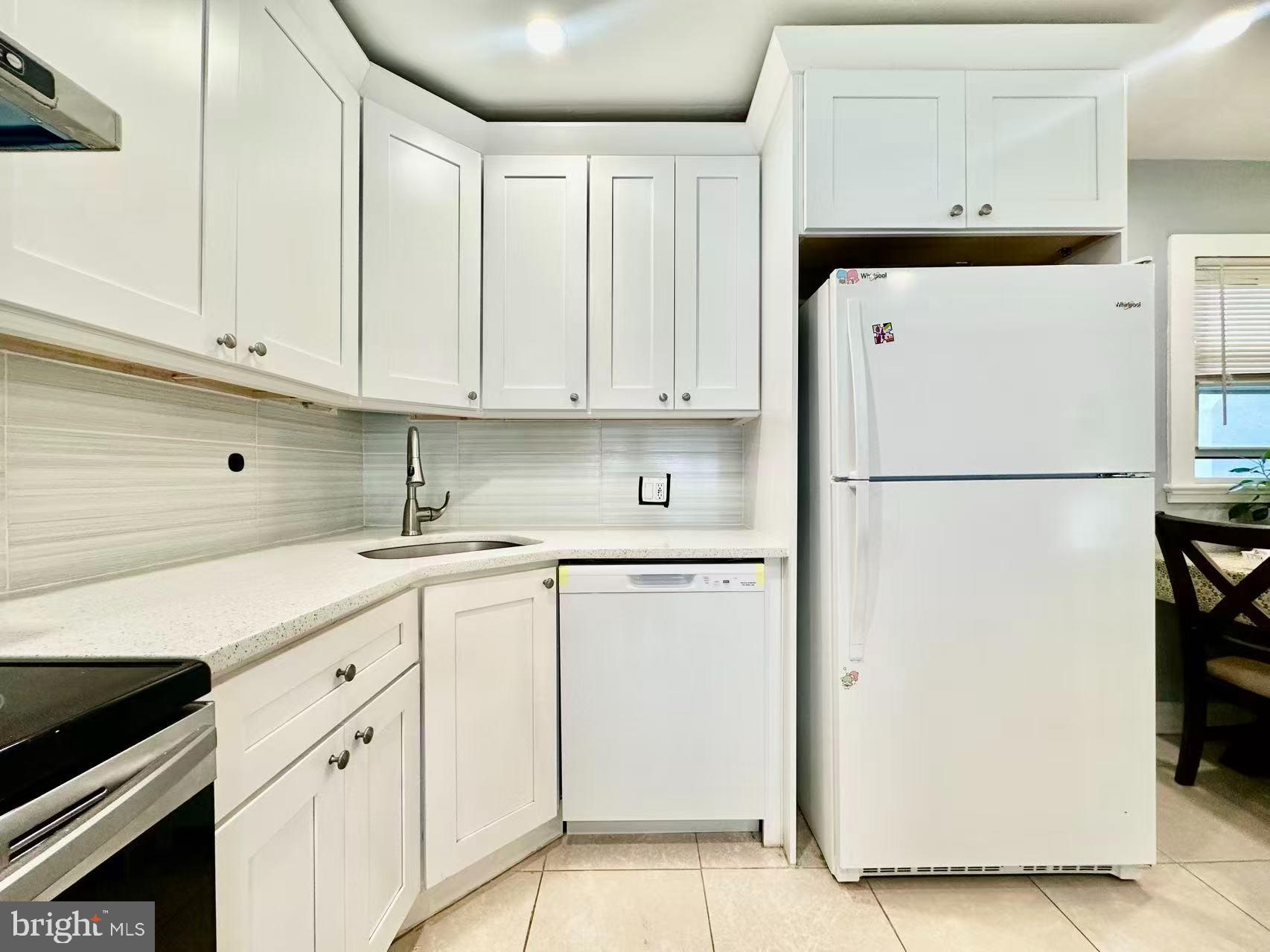 632 Durham Road Newtown, PA 18940 - Photo 10 of 36 a kitchen with cabinets stainless steel appliances and a counter space