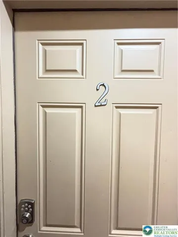 a view of a door and a window