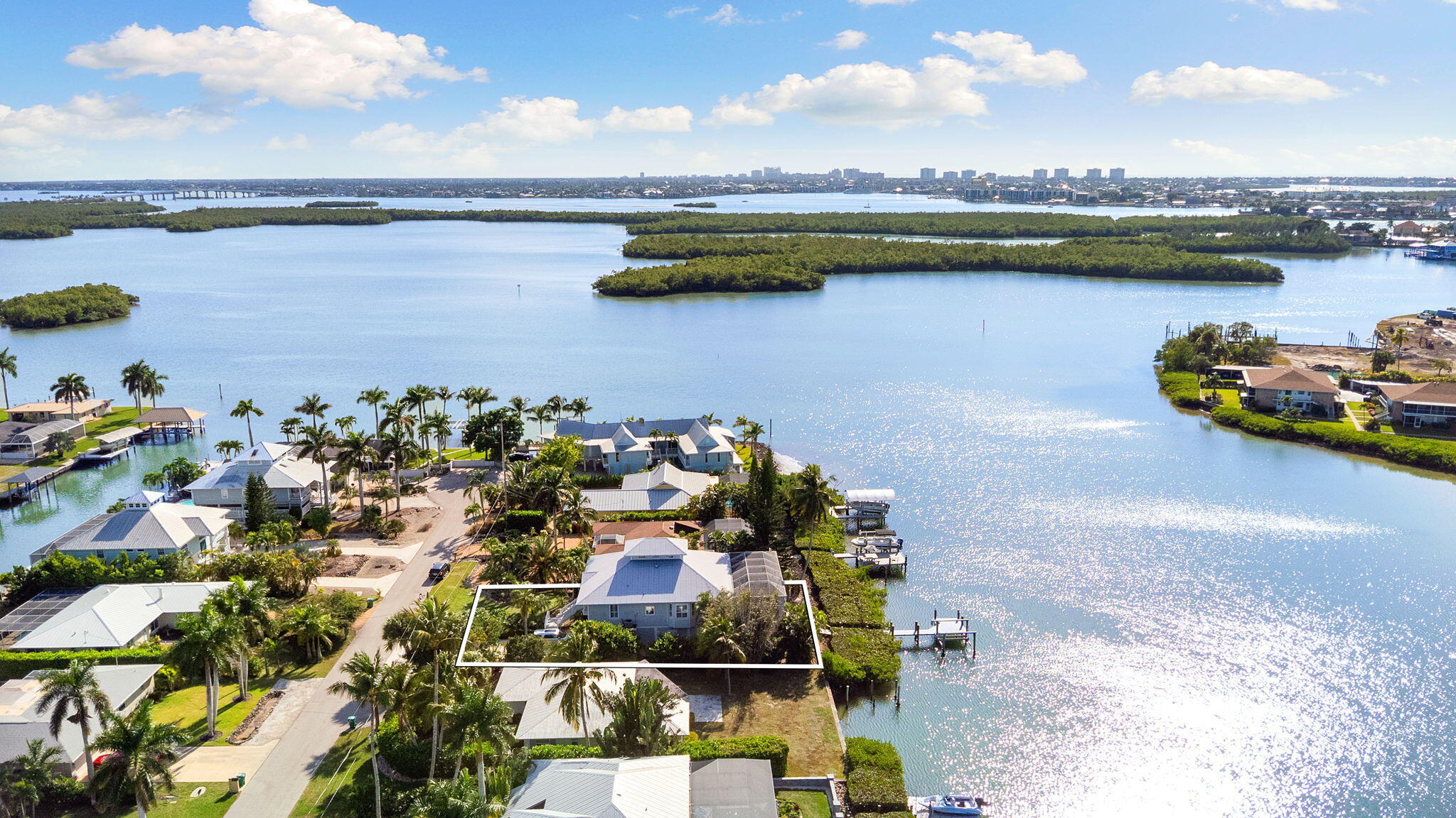 418 Panay Avenue Naples, FL 34113 - Photo 2 of 53 a view of a lake with a lake