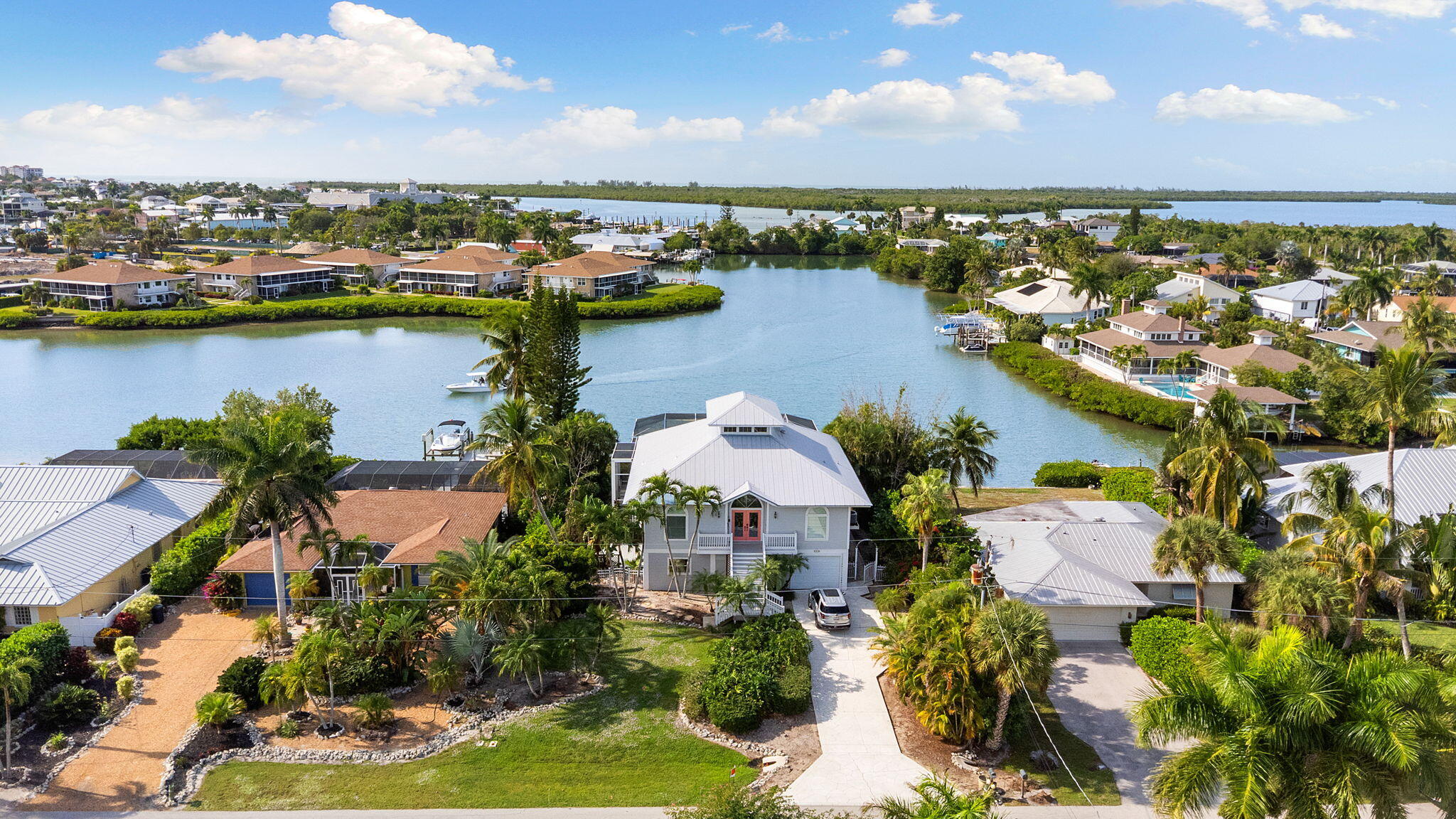 418 Panay Avenue Naples, FL 34113 - Photo 33 of 53 a view of a city with lawn chairs