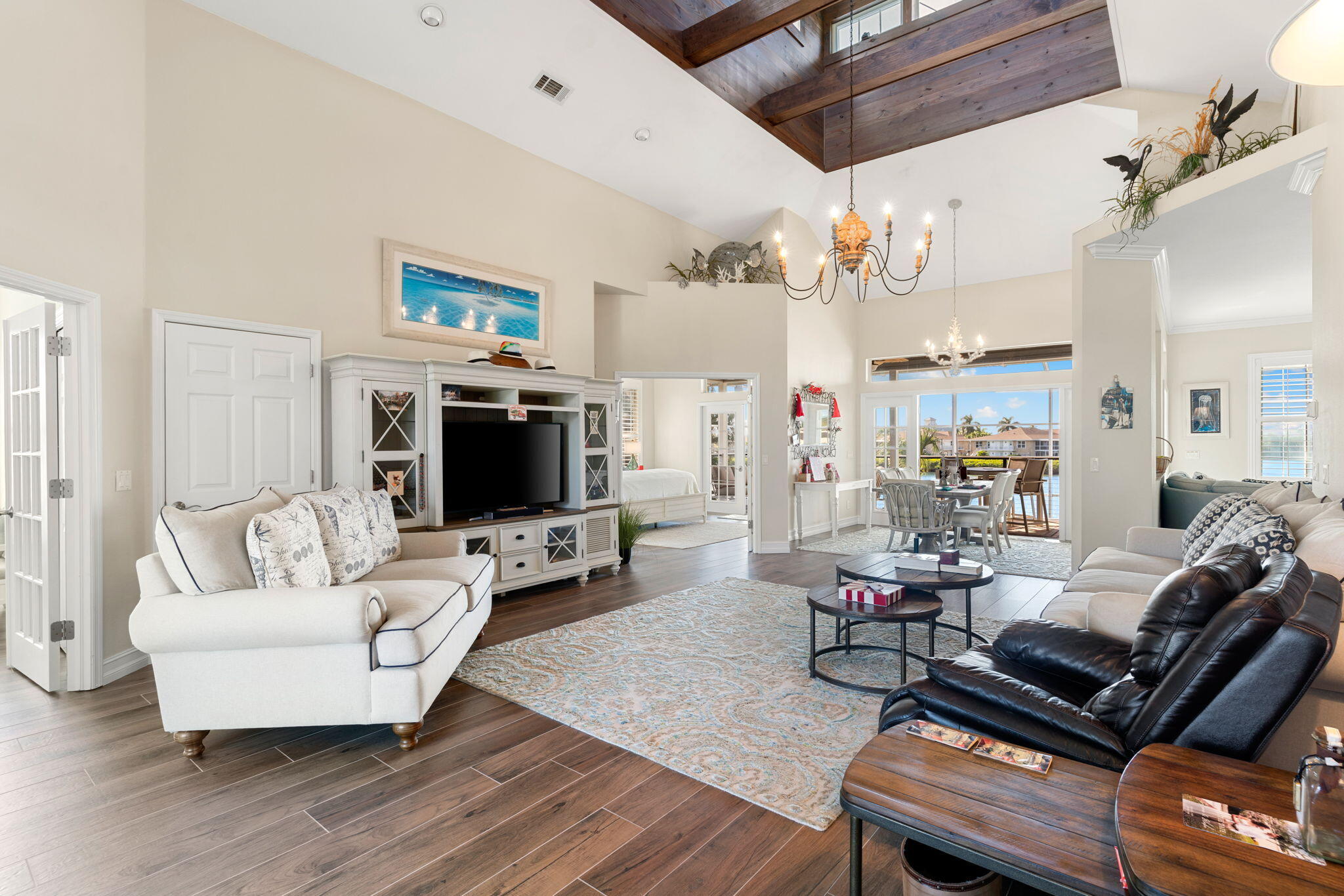 418 Panay Avenue Naples, FL 34113 - Photo 35 of 53 a living room with furniture and a flat screen tv