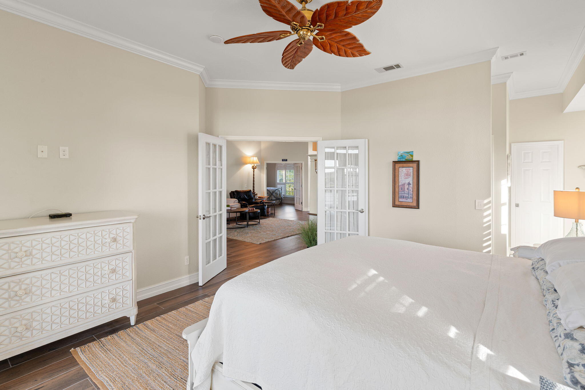 418 Panay Avenue Naples, FL 34113 - Photo 44 of 53 a bedroom with a bed and a chandelier