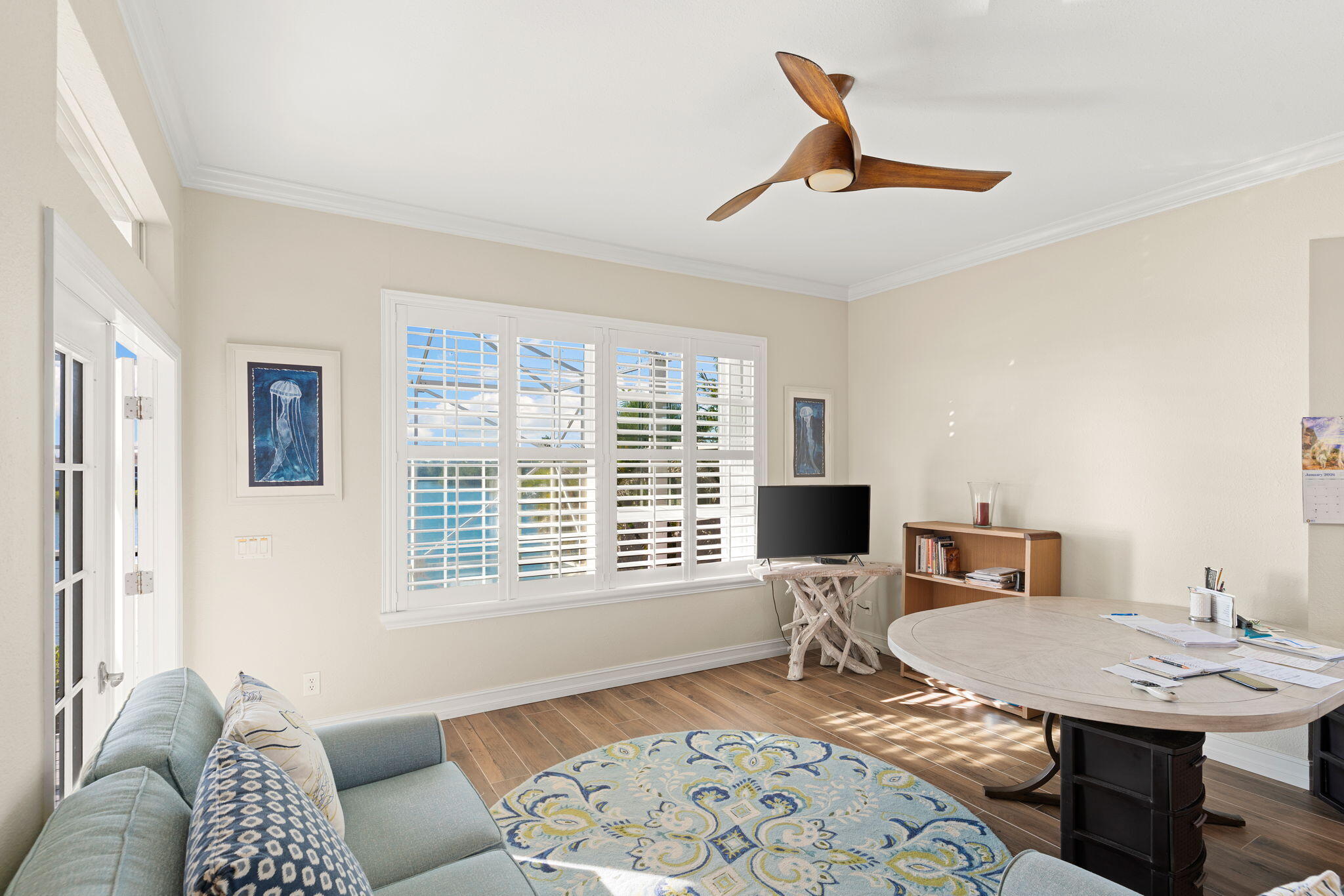 418 Panay Avenue Naples, FL 34113 - Photo 45 of 53 a living room with furniture and floor to ceiling window