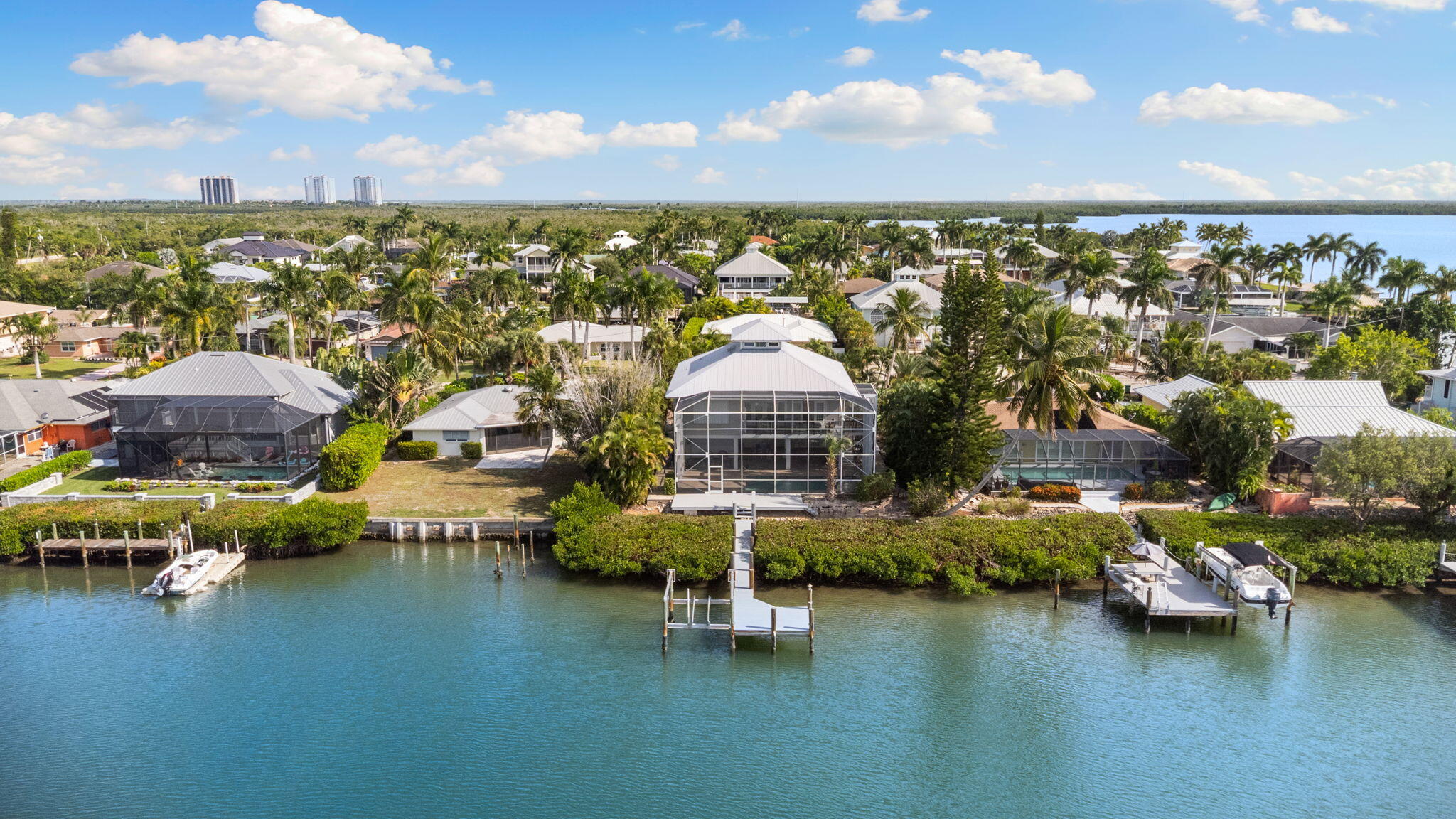 418 Panay Avenue Naples, FL 34113 - Photo 47 of 53 a view of a lake with a city