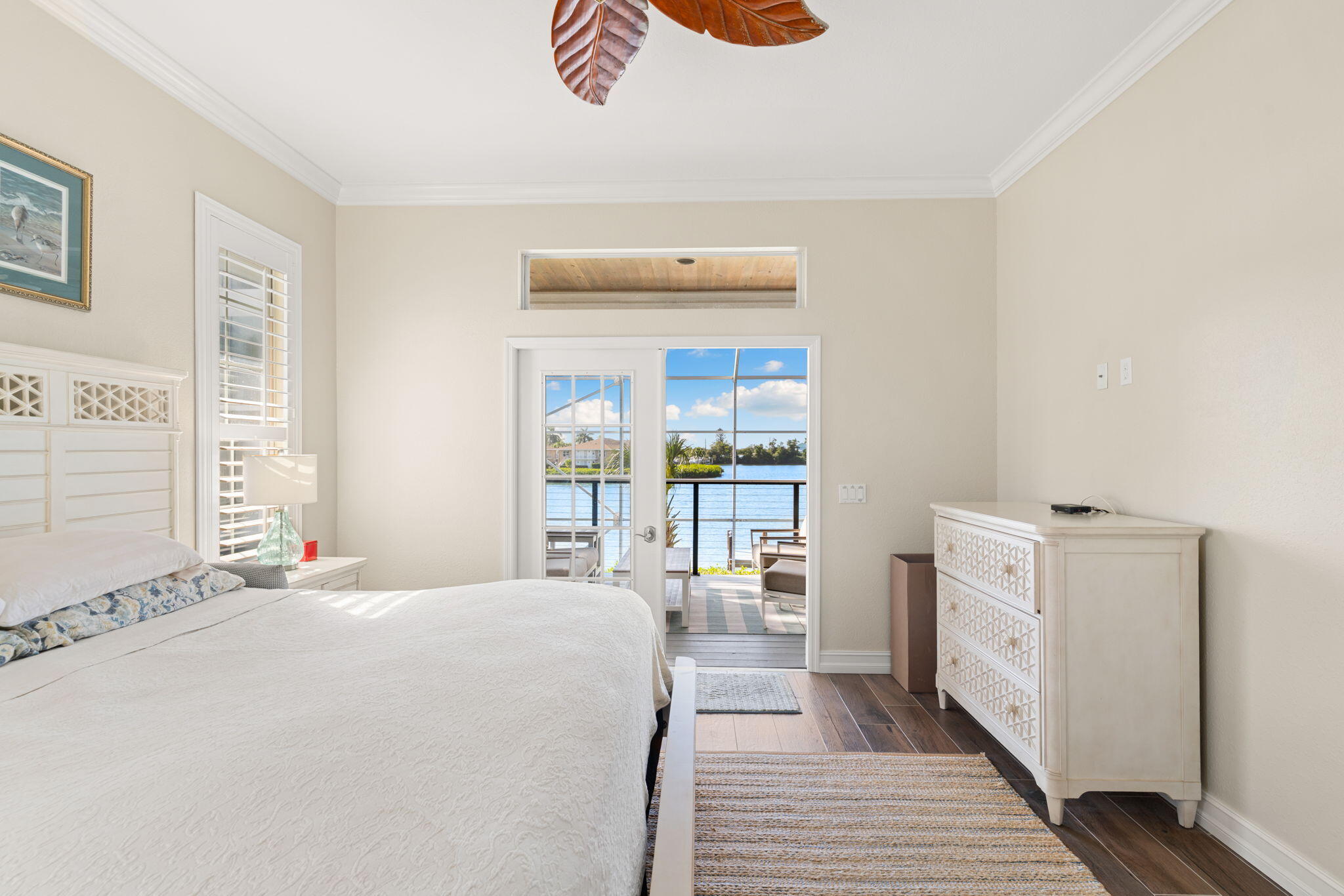 418 Panay Avenue Naples, FL 34113 - Photo 5 of 53 a bedroom with a bed and a large window