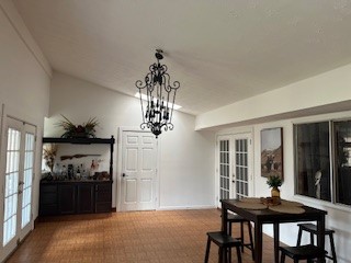 9271 Kempwood Drive Houston, TX 77080 - Photo 6 of 7 a view of a dining room with furniture and chandelier