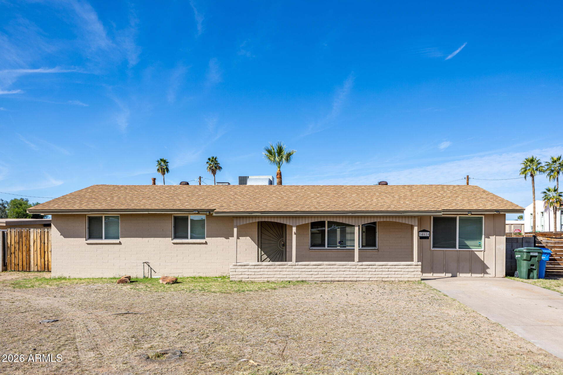 14616 North Ensenada Court Phoenix, AZ 85053 - Photo 1 of 23 a front view of a house with a garden