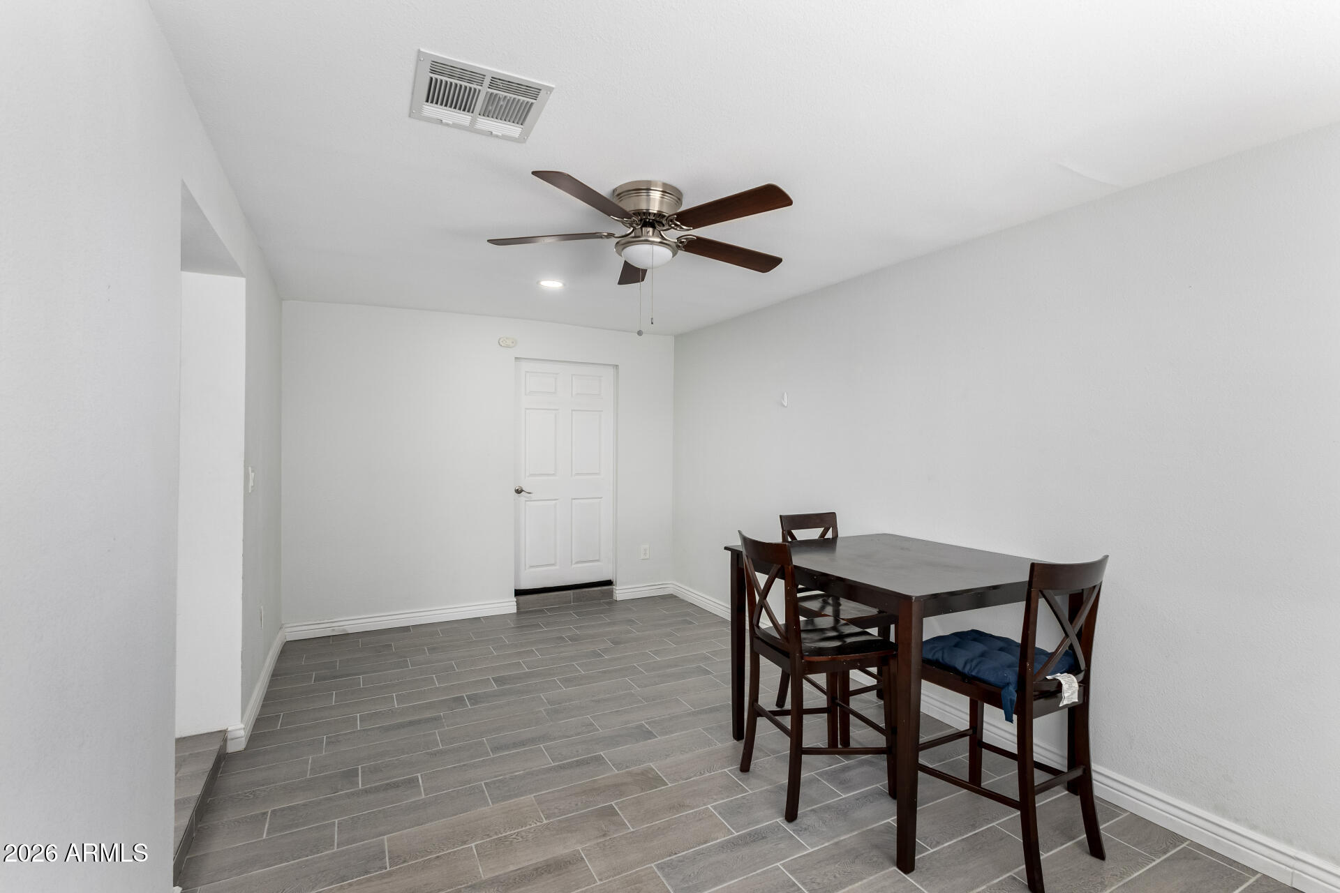 14616 North Ensenada Court Phoenix, AZ 85053 - Photo 11 of 23 a view of a dining room with furniture