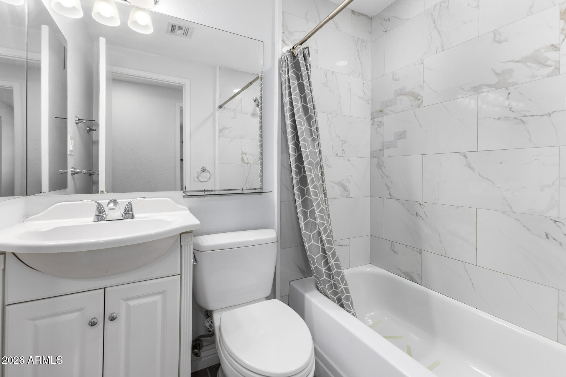 14616 North Ensenada Court Phoenix, AZ 85053 - Photo 19 of 23 a bathroom with a sink toilet and shower