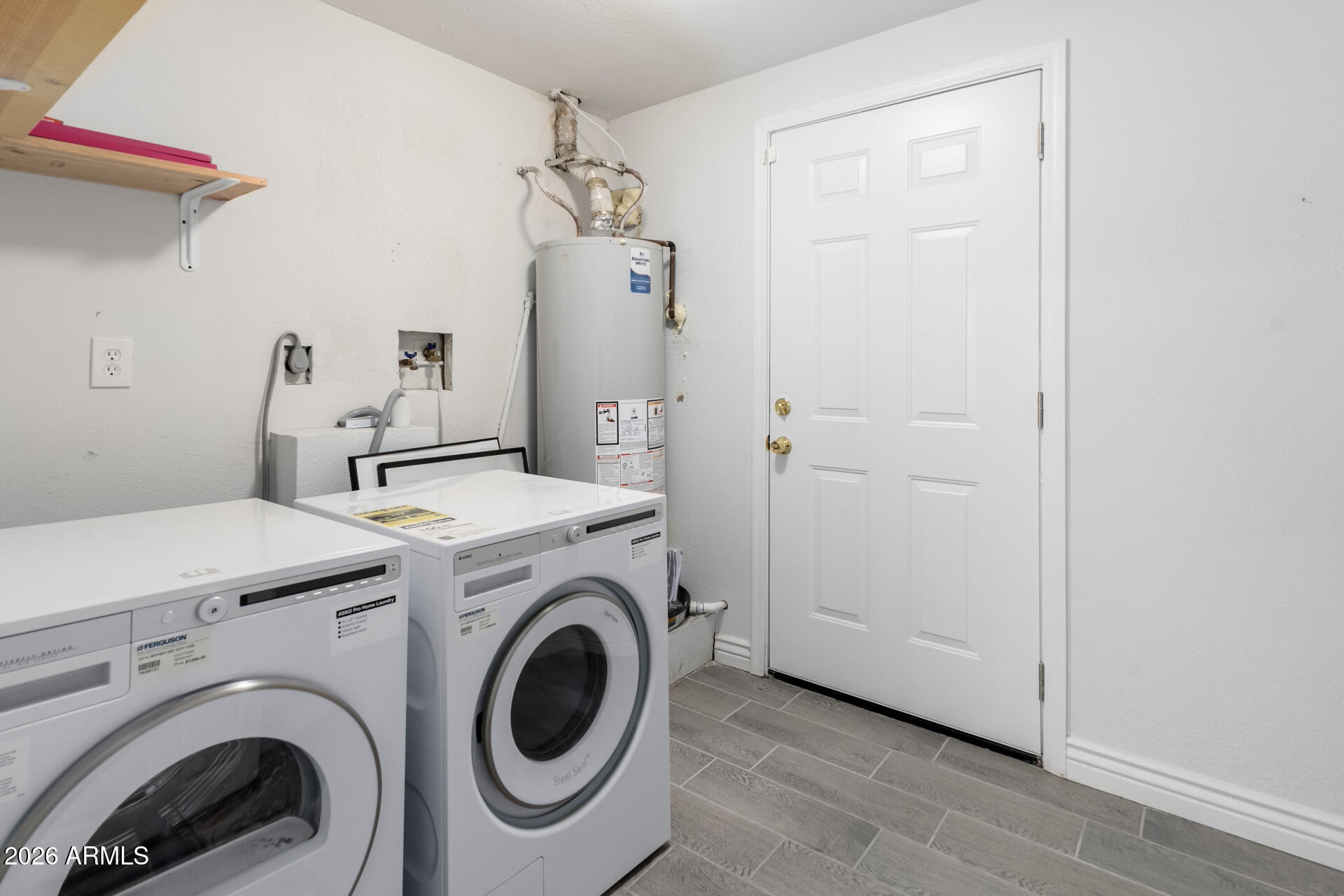 14616 North Ensenada Court Phoenix, AZ 85053 - Photo 20 of 23 a view of storage and utility room with washer and dryer