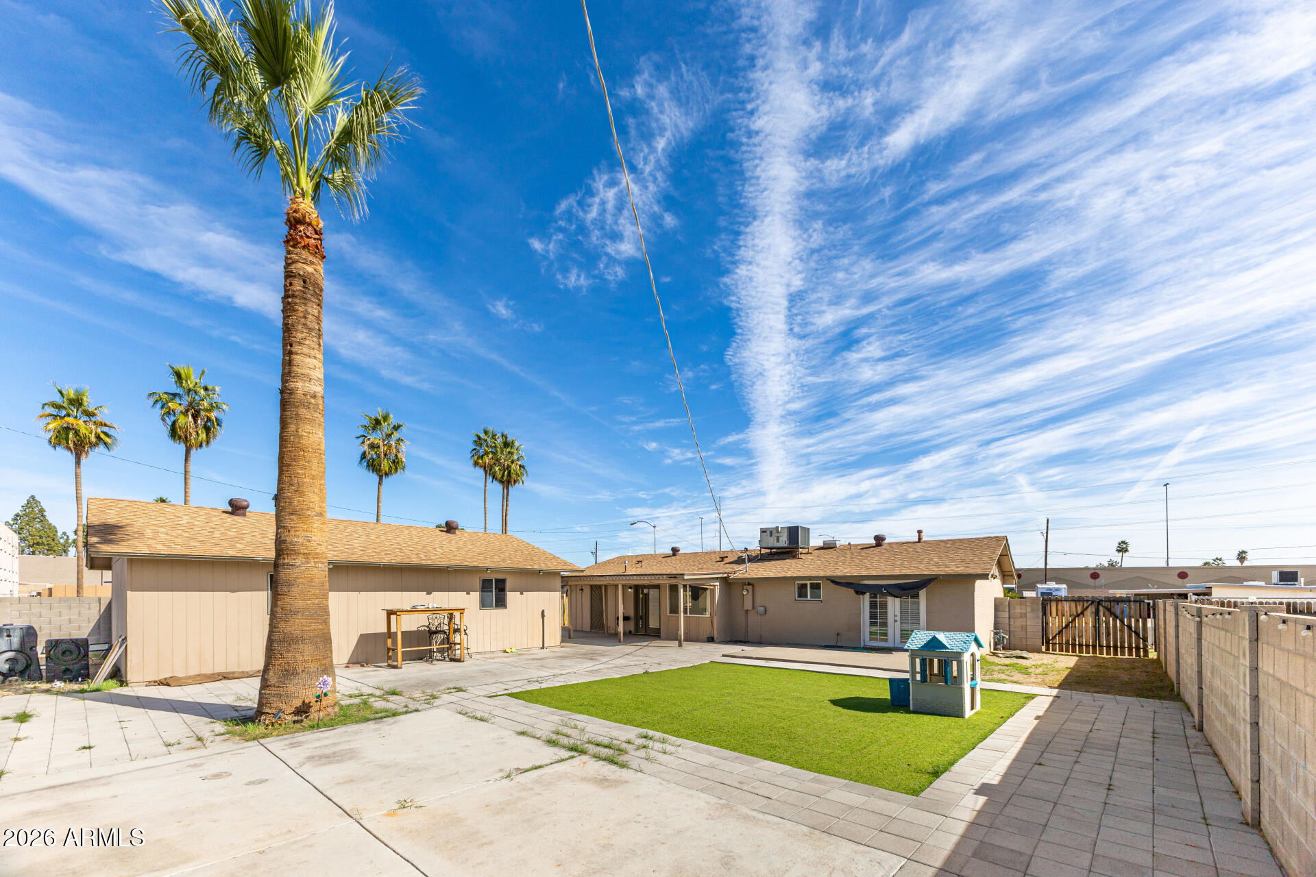 14616 North Ensenada Court Phoenix, AZ 85053 - Photo 22 of 23 a view of a house with pool and sitting area