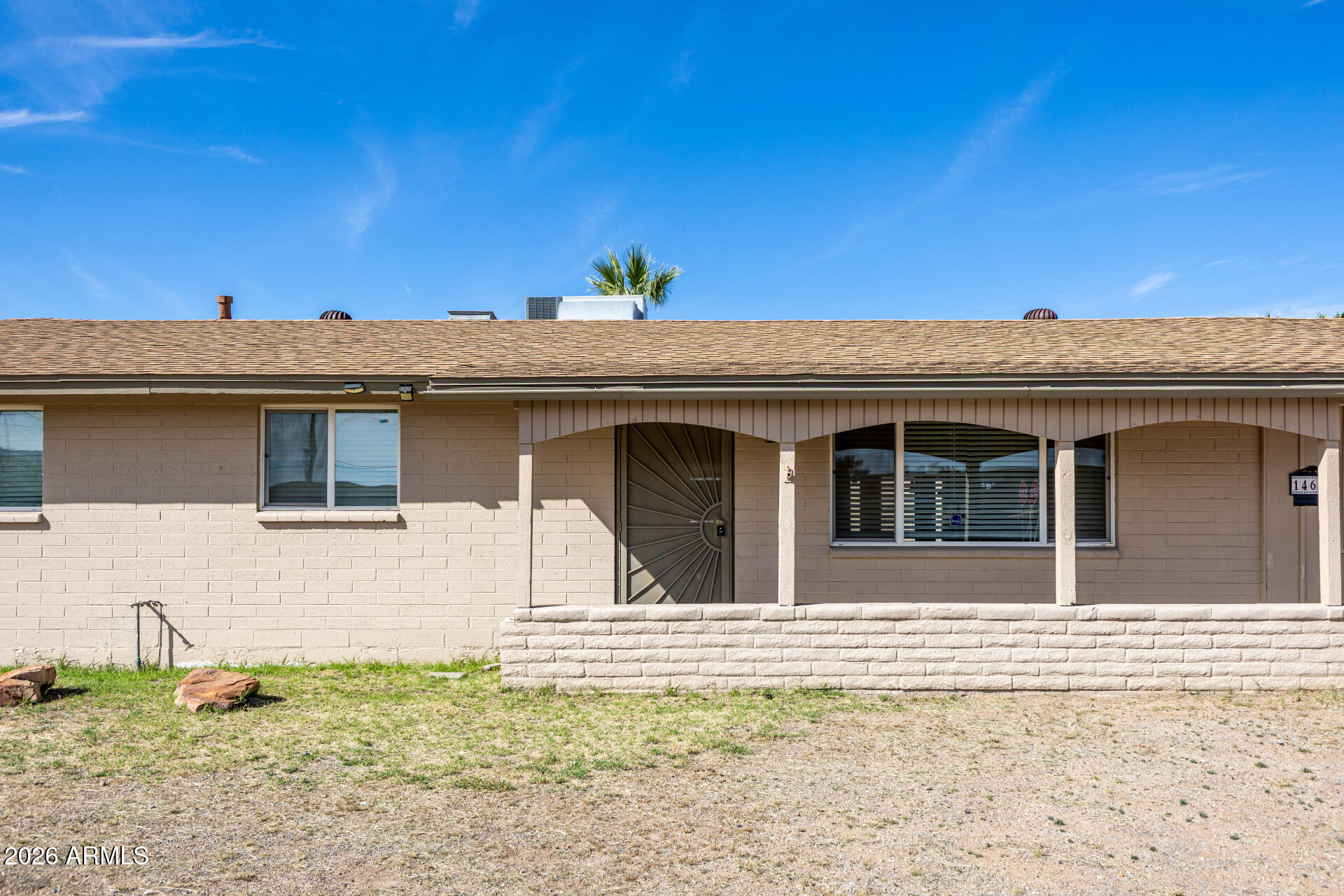 14616 North Ensenada Court Phoenix, AZ 85053 - Photo 4 of 23 a view of a house with a backyard