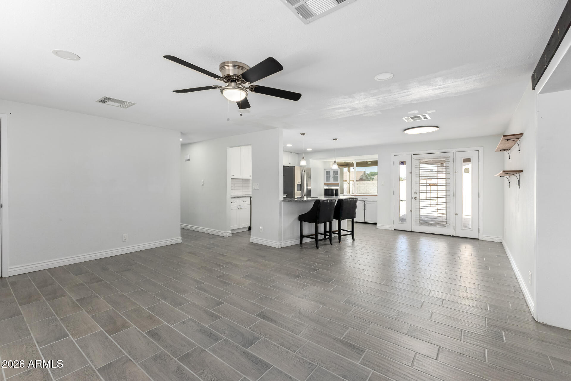 14616 North Ensenada Court Phoenix, AZ 85053 - Photo 6 of 23 a view of work space with wooden floor and windows
