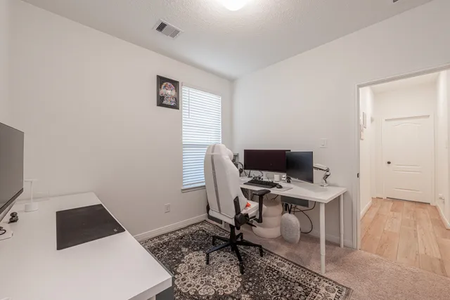 a workspace with furniture and wooden floor