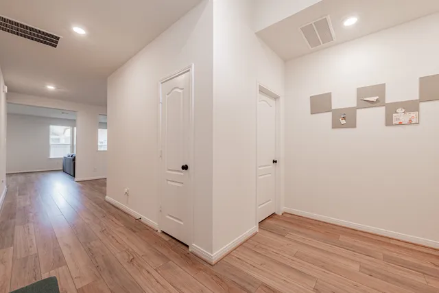 a view of gallery with wooden floor