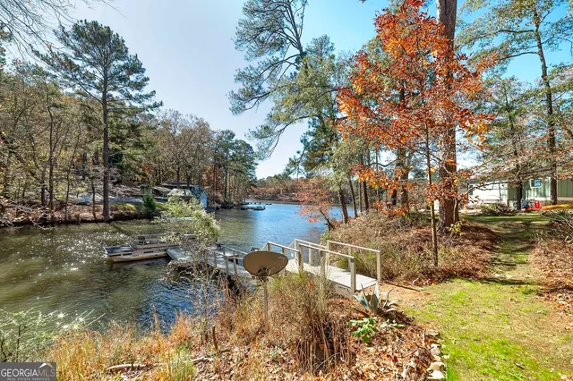 a pathway of a house with a yard