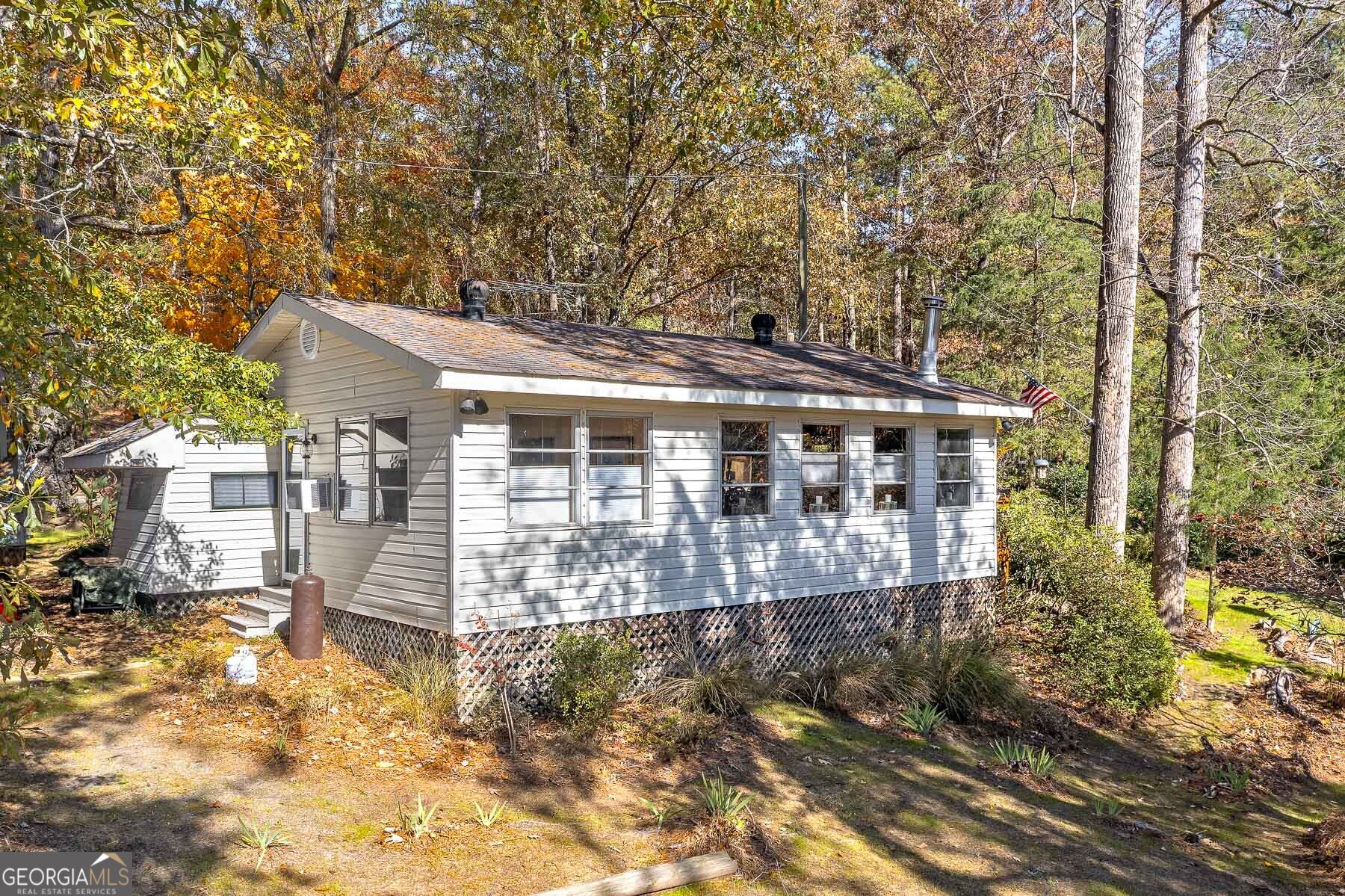 121 Cedar Drive Jackson, GA 30233 - Photo 21 of 50 a front view of a house with a yard