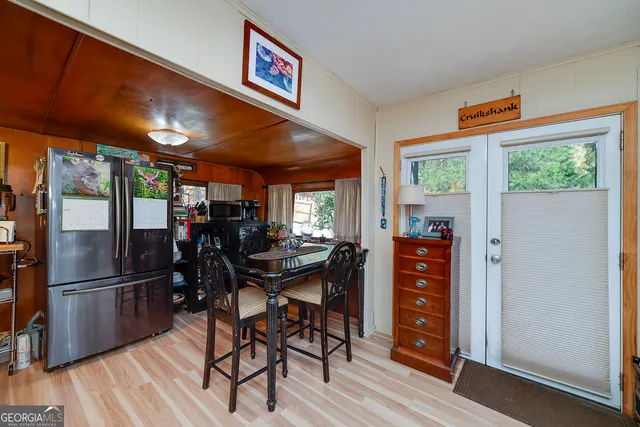 a view of a dining room with furniture window and outside view