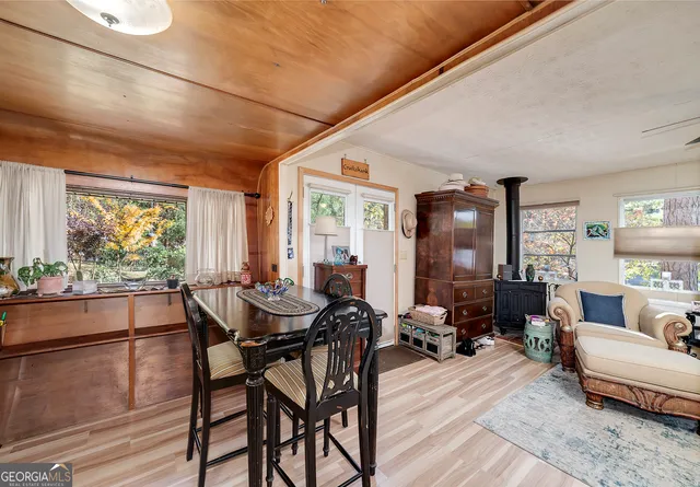 a view of a kitchen with workspace and windows