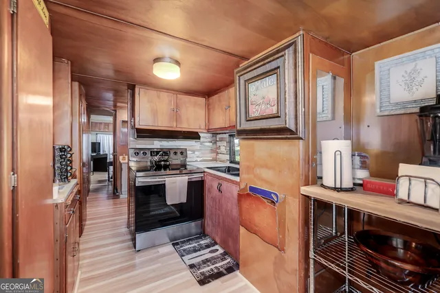 a bedroom with a large bed and a flat tv screen