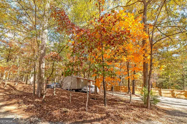 a view of a lake with a house in the background