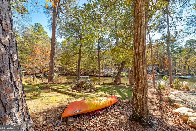 a view of a lake with outdoor seating