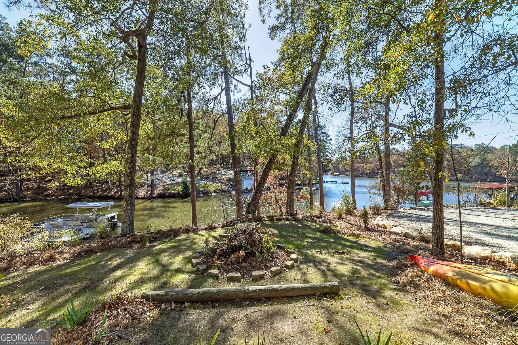 121 Cedar Drive Jackson, GA 30233 - Photo 46 of 50 a view of a lake with a house in the background