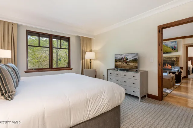 a bedroom with a bed and a lamp