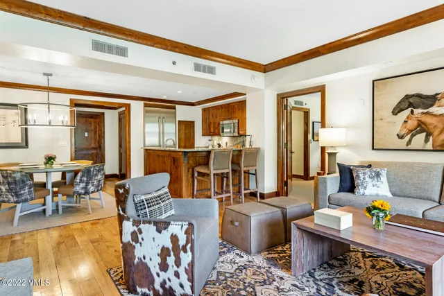 a dining room with a table and chairs