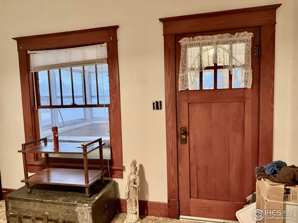 a view of hall way with furniture and windows