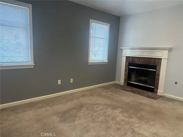 an empty room with a fireplace