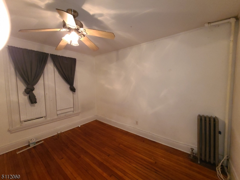 157 Valley Road Montclair, NJ 07042 - Photo 11 of 14 a view of a livingroom with wooden floor and cabinet