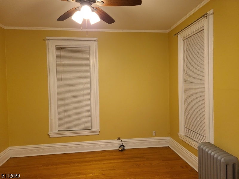 157 Valley Road Montclair, NJ 07042 - Photo 5 of 14 a view of a room with wooden floor and a ceiling fan