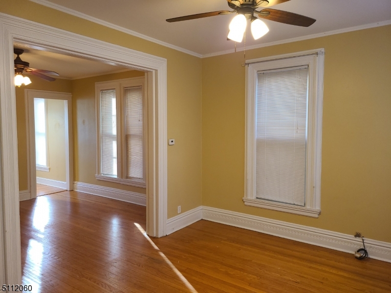 157 Valley Road Montclair, NJ 07042 - Photo 6 of 14 a view of an empty room with wooden floor and a window