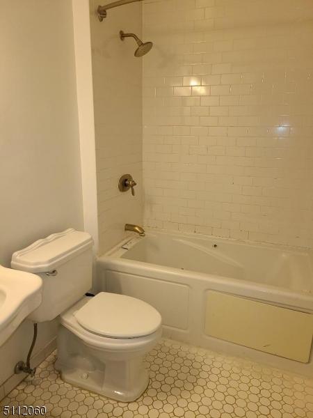 157 Valley Road Montclair, NJ 07042 - Photo 8 of 14 a bathroom with a toilet and a shower