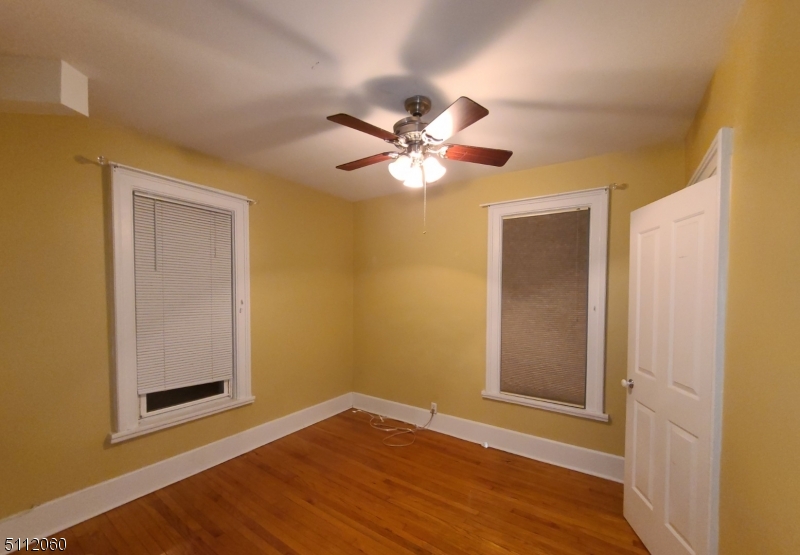 157 Valley Road Montclair, NJ 07042 - Photo 10 of 14 a view of an empty room with window and wooden floor