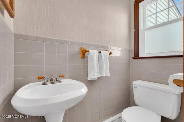 a spacious bedroom with a bed and a table in it