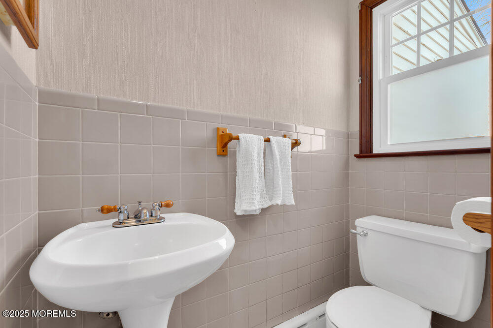1798 Todd Road Toms River, NJ 08755 - Photo 19 of 61 a white sink sitting next to a white toilet
