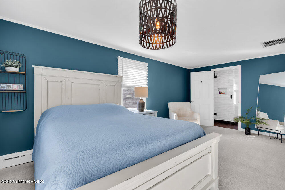 1798 Todd Road Toms River, NJ 08755 - Photo 29 of 61 a bedroom with a bed and a chandelier