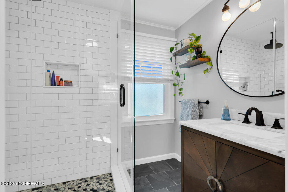 1798 Todd Road Toms River, NJ 08755 - Photo 30 of 61 a bathroom with a sink a mirror and a shower